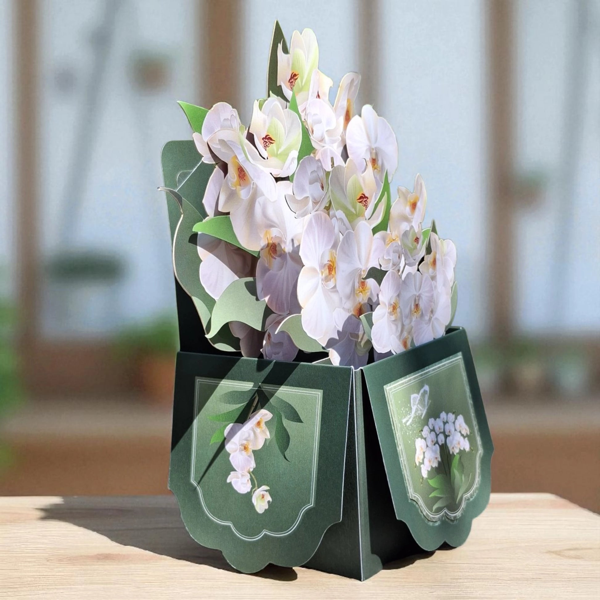 vue 3/4 de la carte en 3D représentant un bouquet d'orchidées blanches